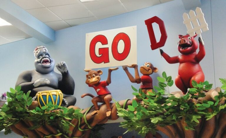 Custom, sculpted sports themed jungle animals on top of entrance ways in a pediatric office