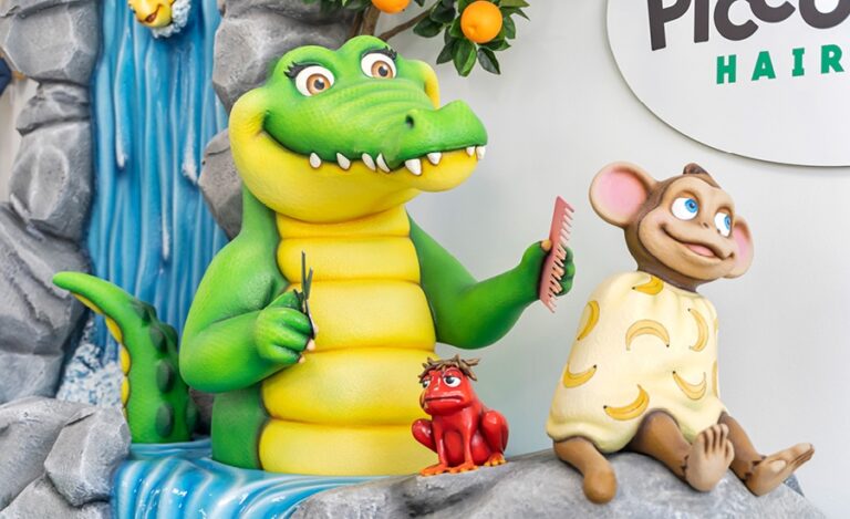 Jungle themed 3D crocodile giving a haircut to a monkey as a red frog with hair stands by
