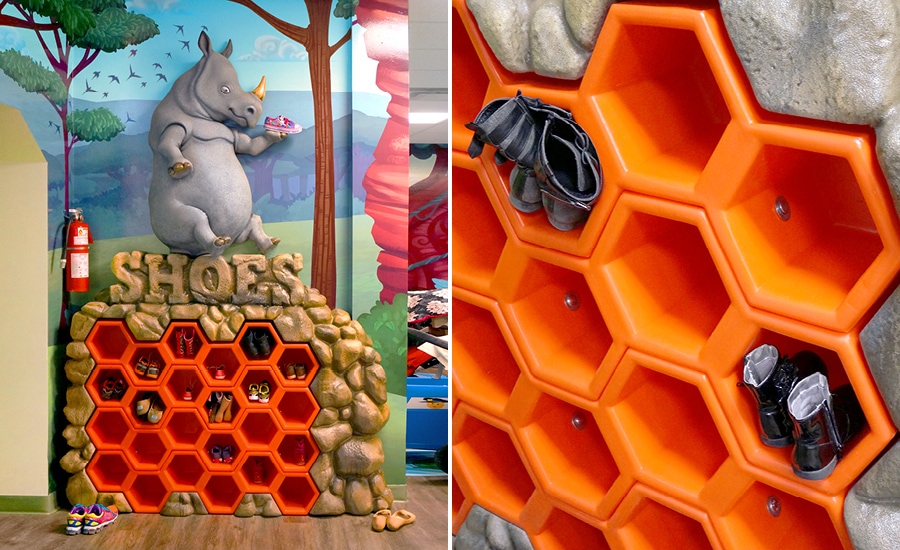 Sculpted rhino character and rock shoe storage unit with honeycomb cubbies