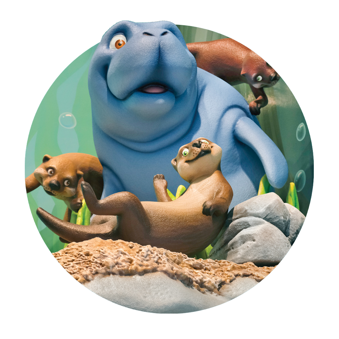 Sculpted otter and manatee characters for a river themed office.