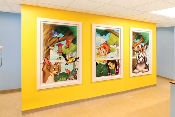 Bright yellow wall featuring three large cartoon-style Faux Window murals with colorful animals, birds, and cheerful children, creating a playful, welcoming atmosphere perfect for a speech therapy room or waiting area.
